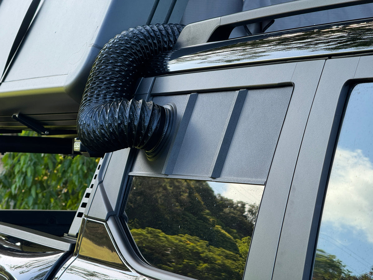 Magnetic quick-connect coupler joining the 4 inch duct to the BYD Shark 6 rear window panel