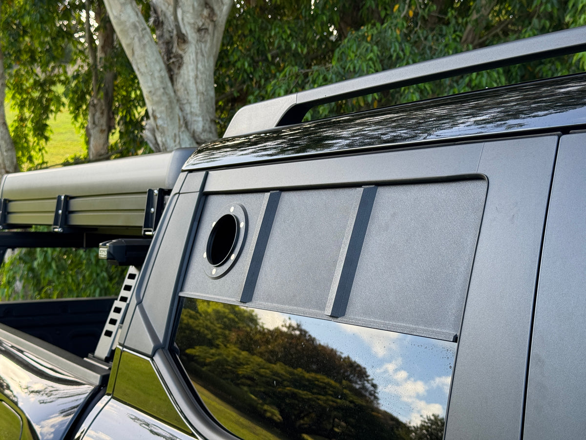 BYD Shark 6 rear window blanking panel installed, showing the sealed 4 inch duct port